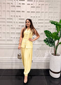 Bhawika Sachdeva model wears the Butter Yellow Pearl Button Balloon Pants Co-ord Set in French crepe — sleeveless mandarin vest with pearl buttons and draped balloon pants